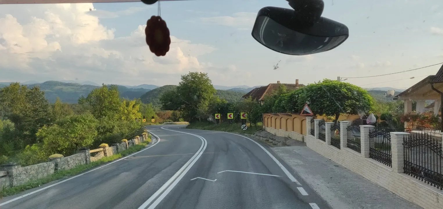 Mountain landscape seen from passenger seat in a truck.